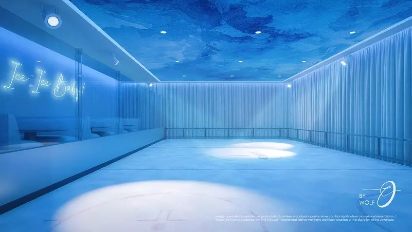 Room without windows,all blue, ice ring and "ice, ice Baby" sign on the wall at Origin by Wolf Cancun