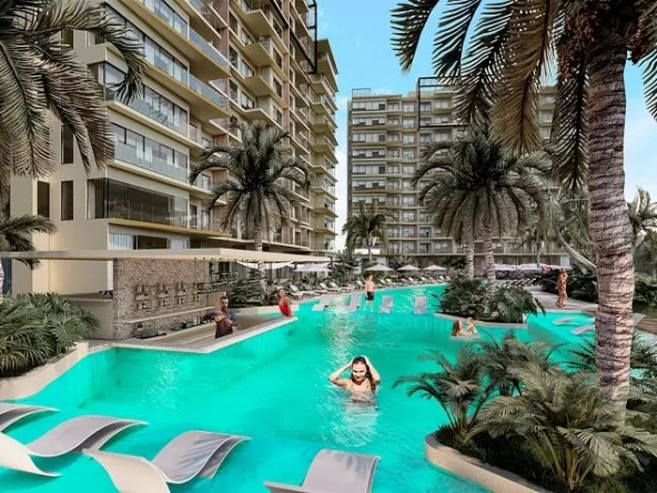Pool, bar and people in the water, residential building facade with balconies at Valle Aurora Cancun