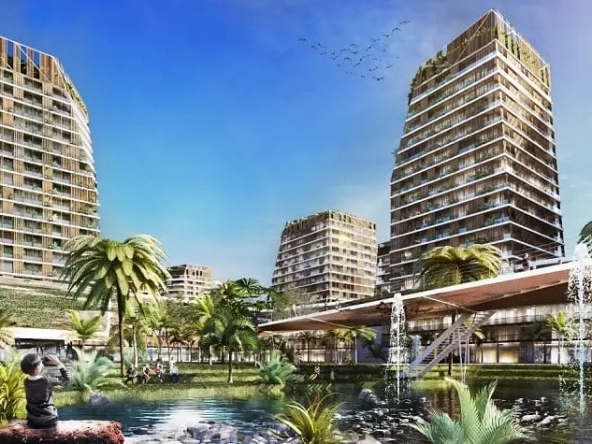 Residential building by a small lake surrounded by palm trees and a boy sitting on a rock at Distrito Yaax Cancun