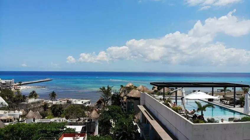 View of a rooftop with a pool and ocean at Isabella Condos