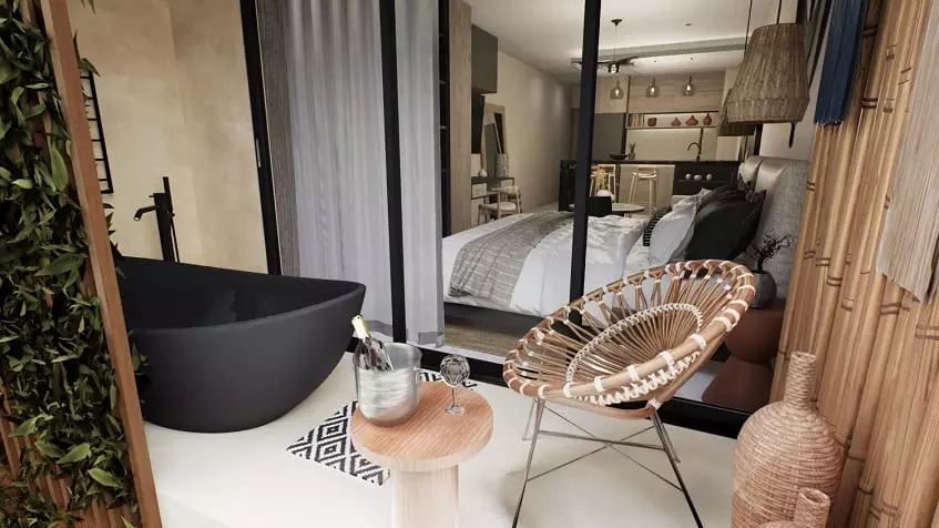 Terrace with a black bathtube of a studio condo at Ix Tulum Apartments