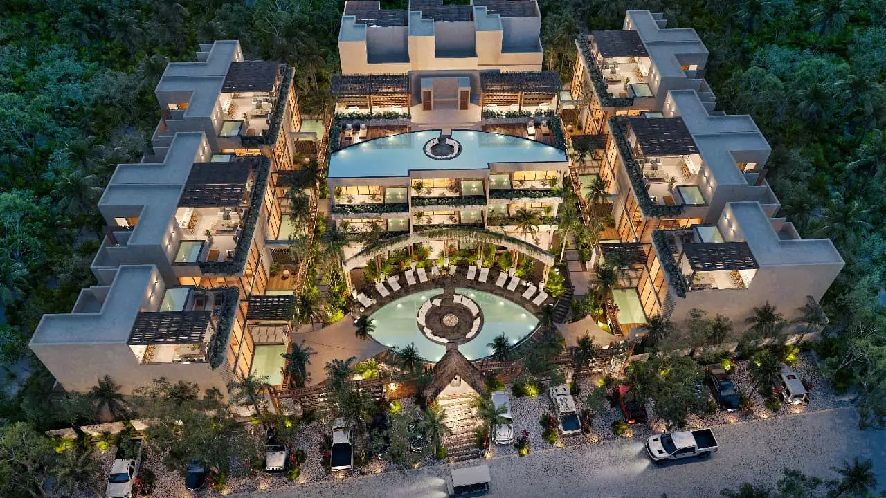 Aerial view of a residential complex with pools, ground floor and rooftop one, as well as plunge pools at Satori Tulum