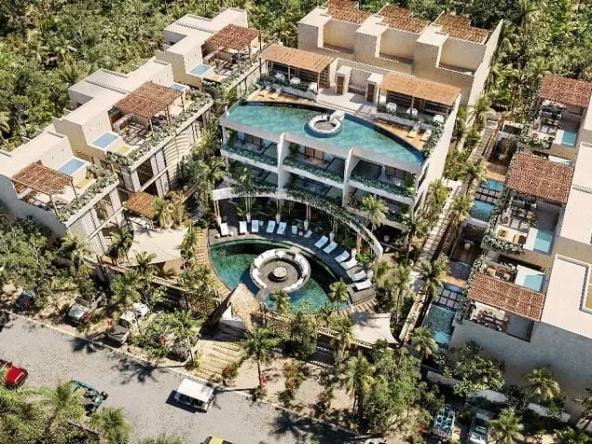 Aerial view of a residential complex with pools, ground floor and rooftop one, as well as plunge pools at Satori Tulum