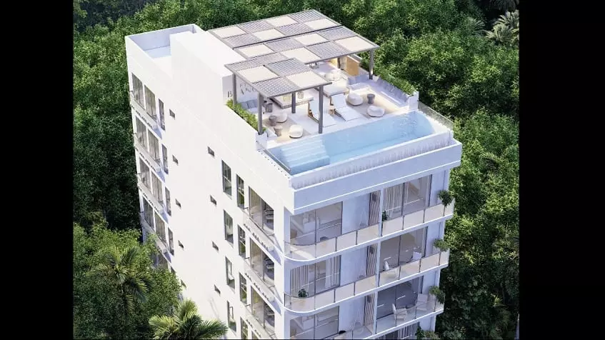Rooftop of the residential building with a pool and a lounge at Fifty Blanc Playa del Carmen