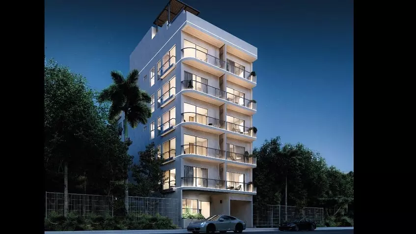 Residential Building facade with balconies at night time at Fifty Blanc Playa del Carmen