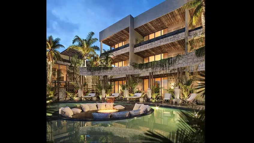 Residential building facade, pool and fire pit nest at Satori Tulum