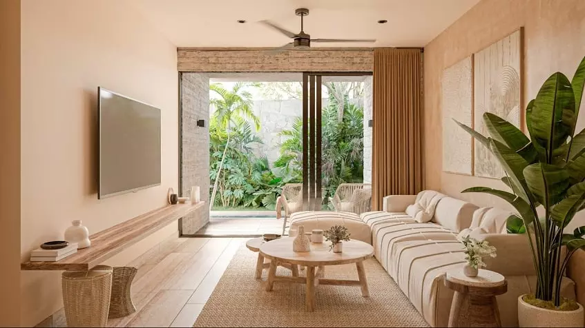 Living room with a sofa in front of TV screen, terrace with a garden at Nuup Tulum Region 8