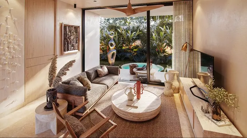 Living room with a sofa in front of a TV screen, terrace with a plunge pool at Oniric Tulum