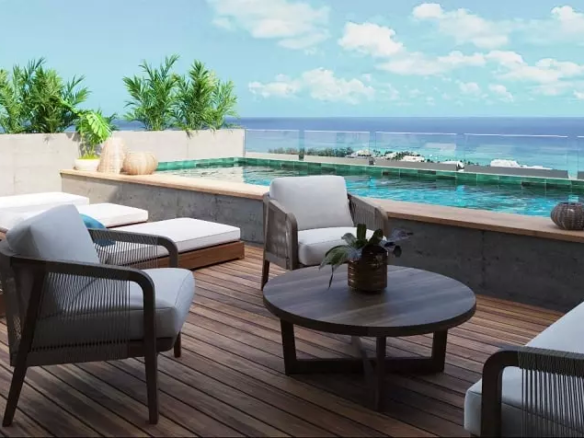 Wooden deck with sunbeds and pool, ocean view at Xiol Playa del Carmen