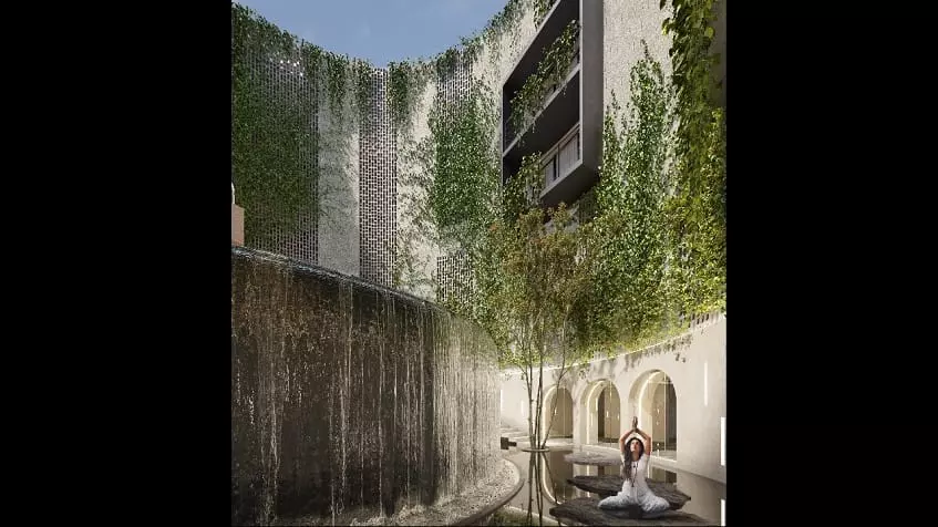 Waterfall, a woman practicing yoga, residential building facade at Oniric Tulum