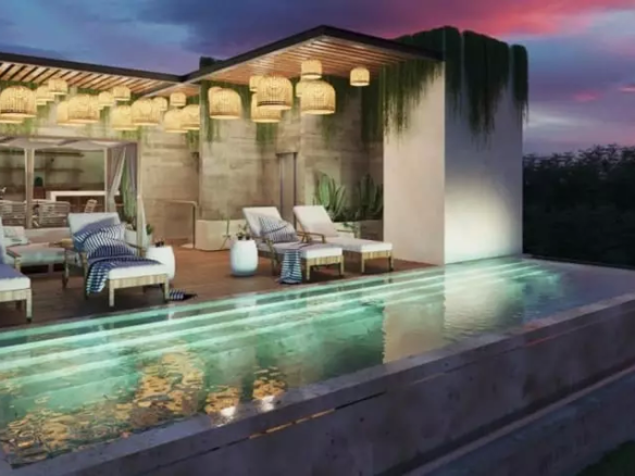 Rooftop pool and sunbeds during a sunset, pergola behind at Spirit Condos 1904