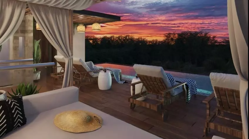 Rooftop pool and sunbeds during a sunset colorful sky at Spirit Condos 1904