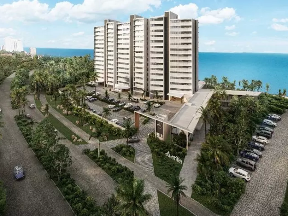 Residential building next to a street surrounded by green area in Antilia Cozumel
