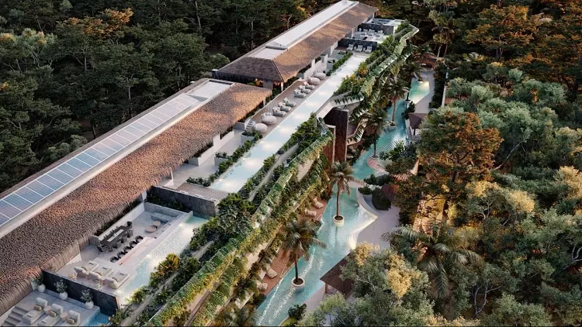 Aerial view of a residential building with a pool rooftop and ground floor pool,jungle at Brahma Tulum