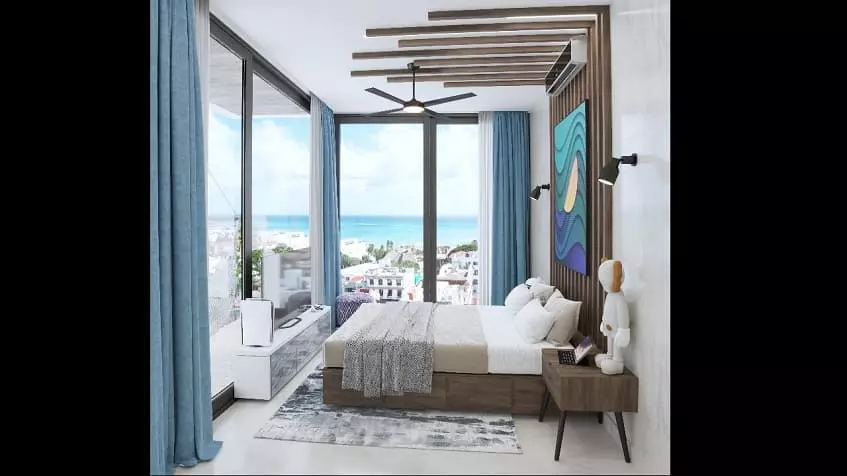 Bedroom with a closet and view of a city and ocean, corner window at Ocean View
