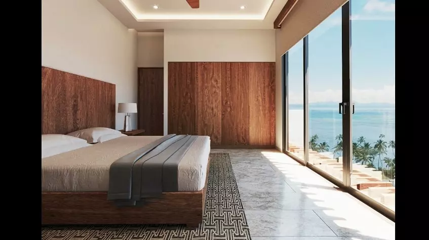 Bedroom with an ocean view at Athimar Cozumel