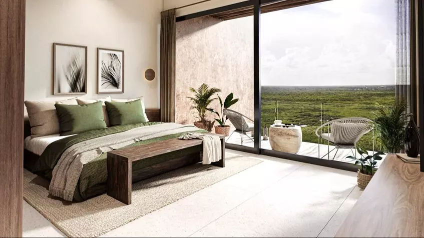 Bedroom with a wall size window, terrace jungle view at Tulum Bay Tankah