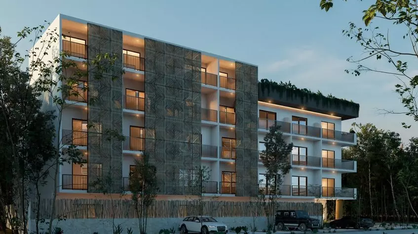 Residential building facade after a sunset, parking area in front at Lik Xelba
