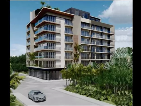 Residential building by a street, jungle around at Quartier 75 Playa del Carmen
