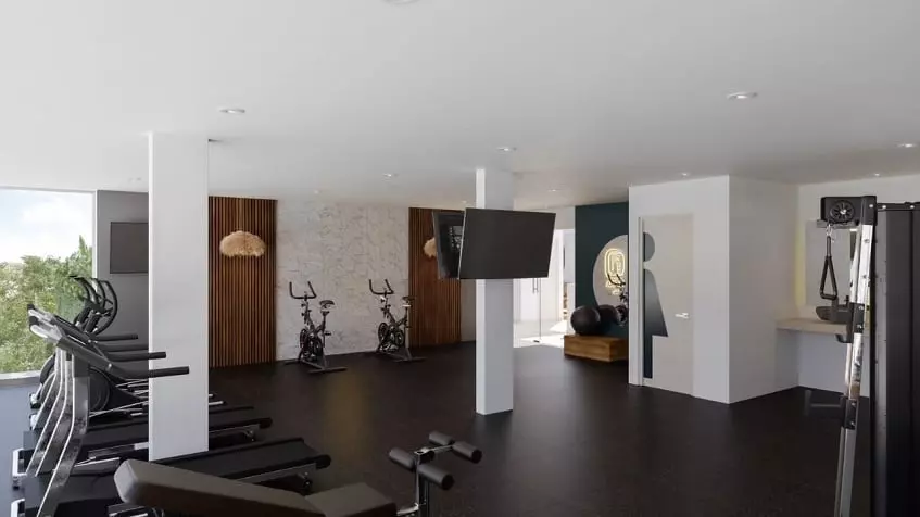 Gym room with treadmills, TV screens on the wall at Lik Xelba