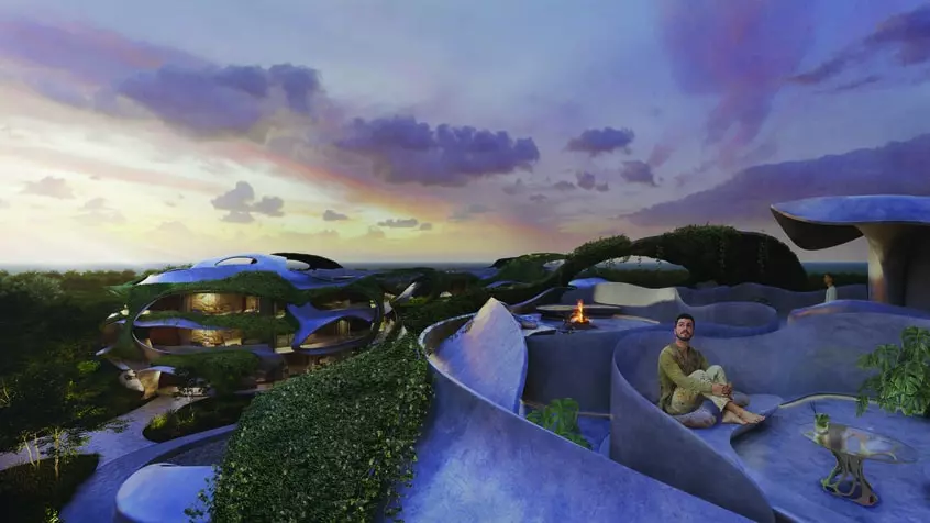 Rooftops of few residential buildings and a man sitting next to a fire pit at Azulik Residences Tulum