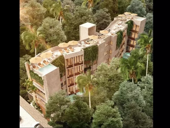 Aerial view of building surrounded by trees in Mya Essence Tulum