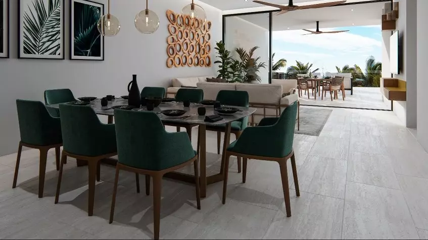 A green dining room with chairs and a terrace with wooden chairs in Acanta Telchac Puerto