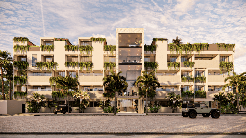 Exterior facade of building with 2 cars parked outside at Hygge Tulum