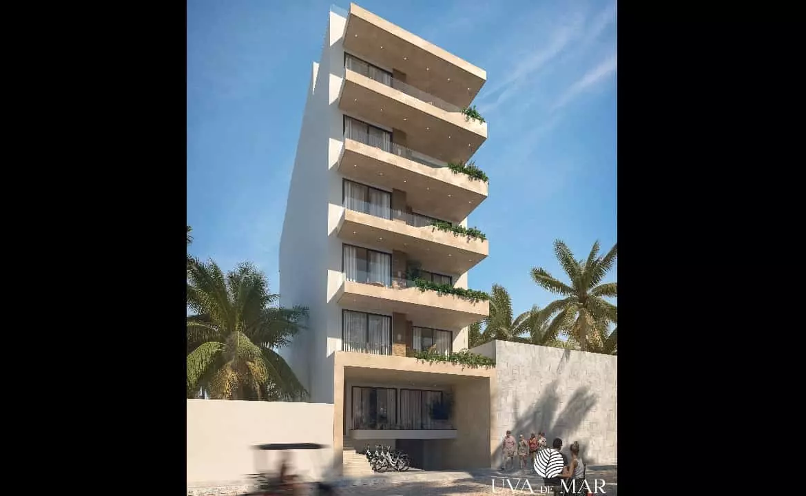 Exterior façade of building with people walking in Uva de Mar Puerto Morelos