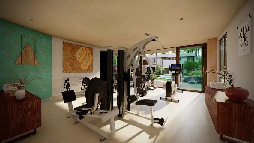 A gym overlooking the pool in Laurel Cozumel