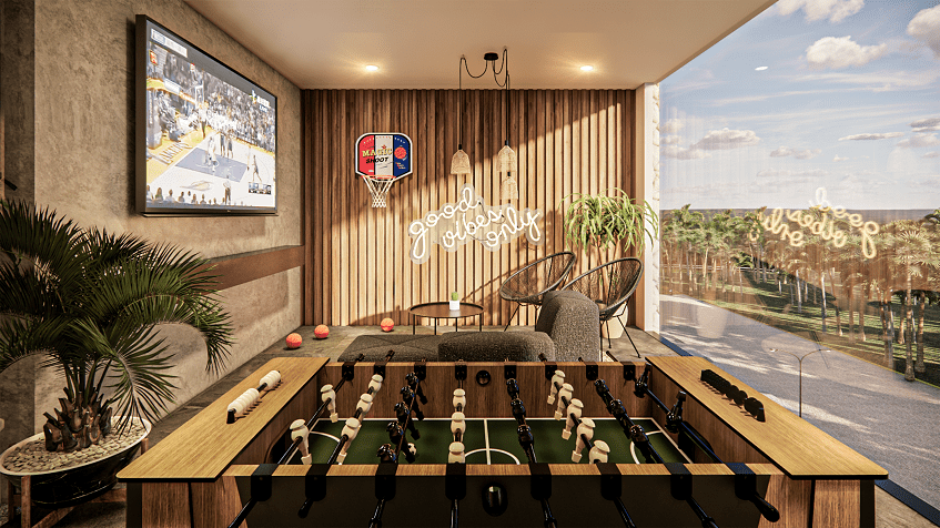 A game room with a large window overlooking the outside at Hygge Tulum