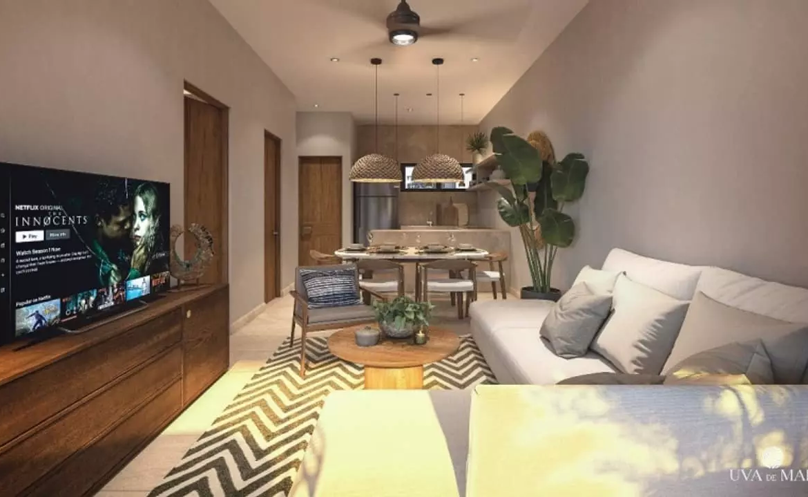An open plan living room with dining area in Uva de mar Puerto Morelos