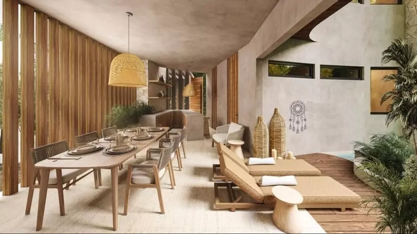 A large dining room, a pool with lounge chairs at Mya Essence Tulum