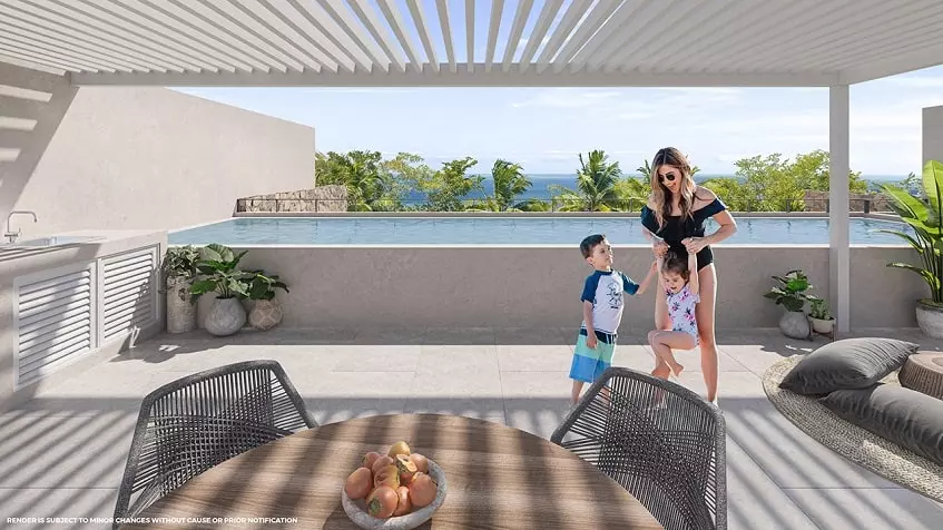 Rooftop terrace with a pool and pergola and a woman playing with 2 kids at Santamar Prime Akumal