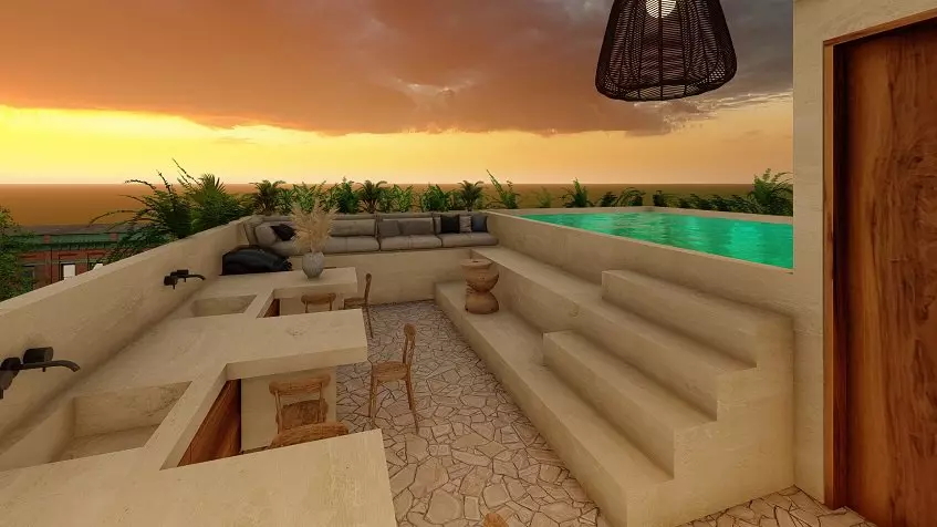 Rooftop pool and lounge area at sunset at Eden Playa del Carmen