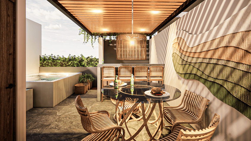 A terrace with a pool and a table at Hygge Tulum
