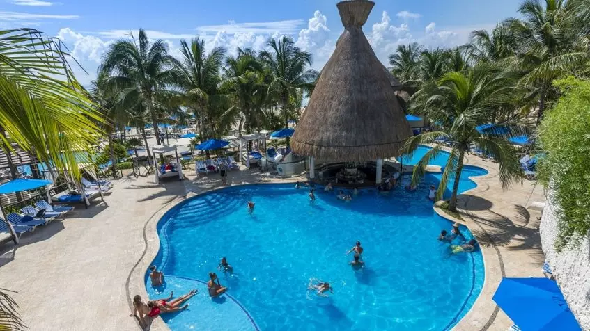 A beach club with pool and palapa at Vi-ha 36 Playacar