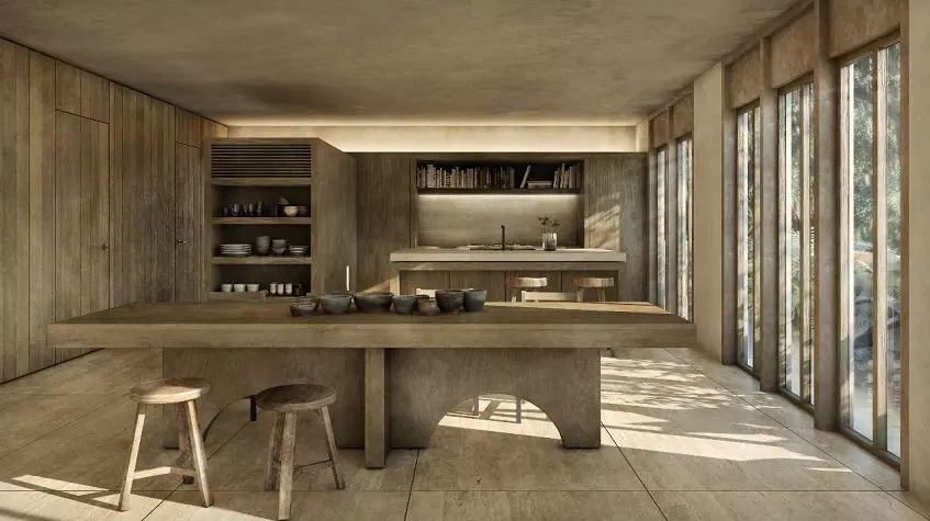 A large kitchen and dining room with 2 stools and a large window in Candela Tulum