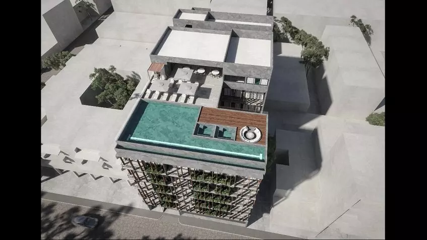 Aerial view of a building and a pool at Olaya Playa