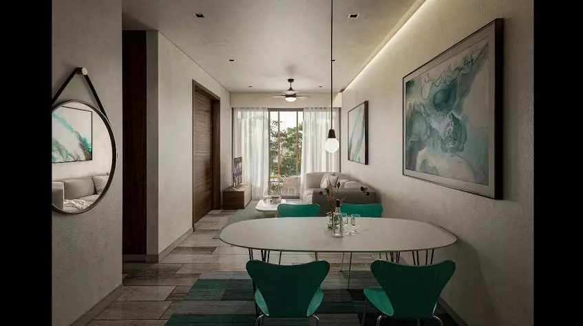 A room with a sofa and a dining room and green chairs at Olaya Playa