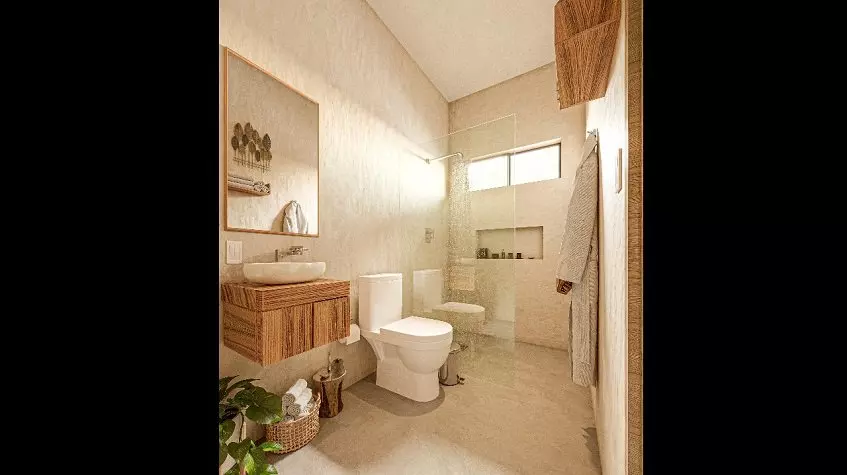 A bathroom with a toilet, sink, and mirror at Core Tulum