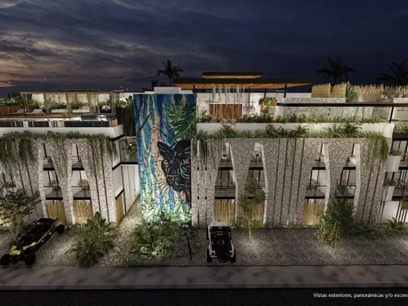 Residential building facade, black jaguar painted, 2 cars parked in front at Zamajal Tulum