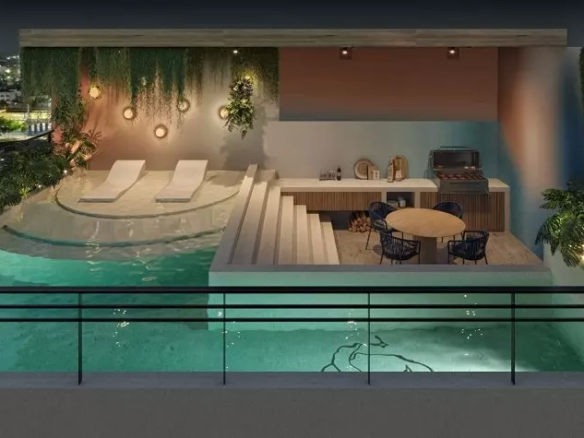 Grill terrace with a round table, pool, solarium island at Corazon de Playa