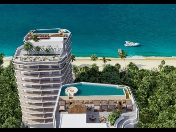 Aerial view of an apartment building with ocean view in Mar A'bella Cancun