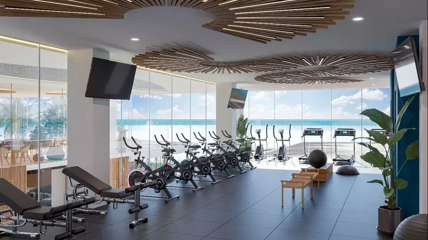 A gym overlooking the ocean at Mar Bella Cancun