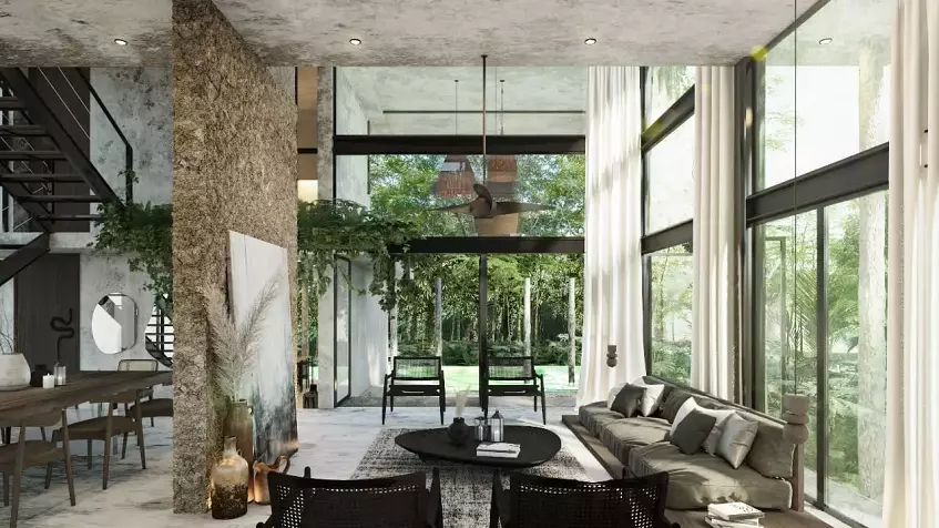Living room, dining room, sofa and large windows overlooking the garden in Consciente Tulum