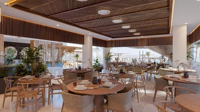 Restaurant with chairs and tables at Mara Bell Cancun