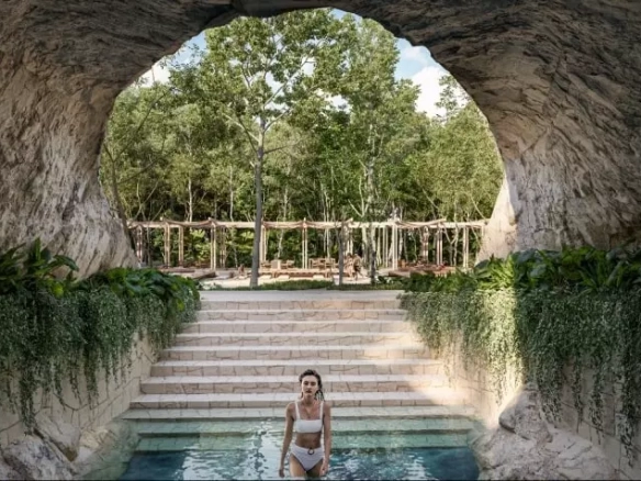 A woman descending into a pool at Lunara Akumal