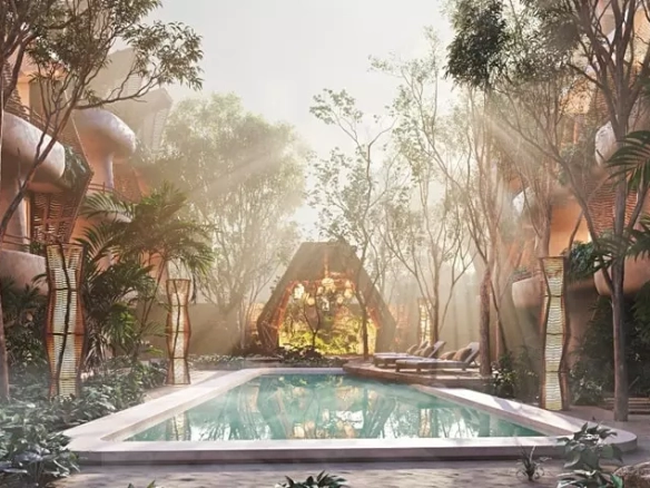 A large pool with lounge chairs in Grand Selva Tulum