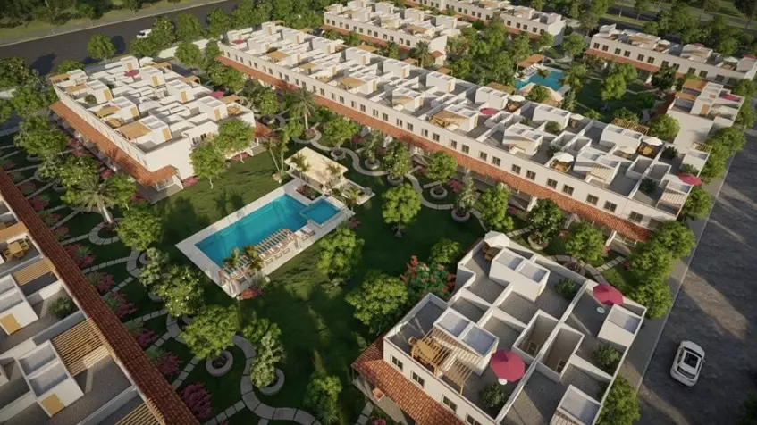 Aerial view of several houses with two common swimming pools at Zendala Residencial Playa del Carmen